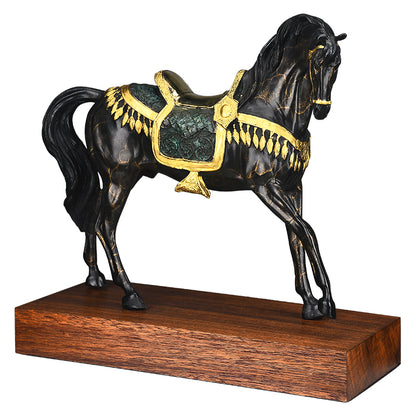 Black horse with gold saddle