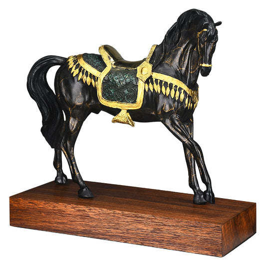 Black horse with gold saddle